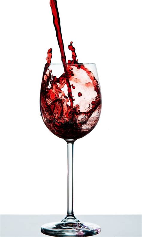 Red Wine Being Poured Into A Crystal Wine Glass Stock Image Image