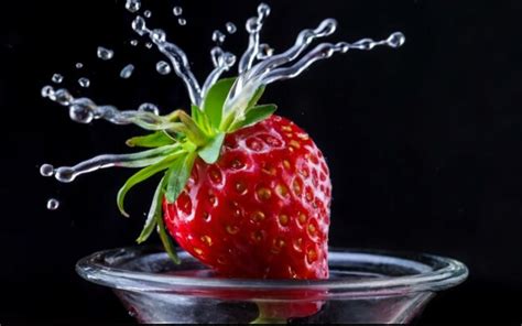 Premium Photo Strawberry Falling Into The Water