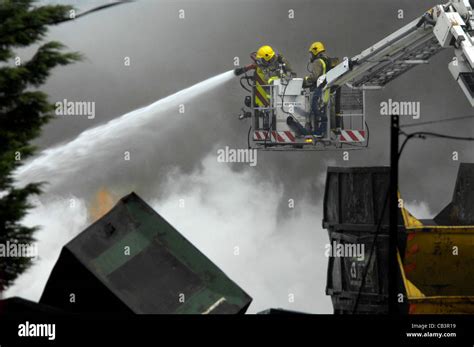 Fire Fighters Tackle A Blaze At A Recycling Center East Sussex Stock