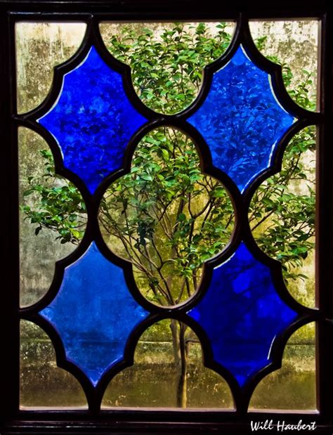 Garden View Through Stained Glass Window In Humble Administrators