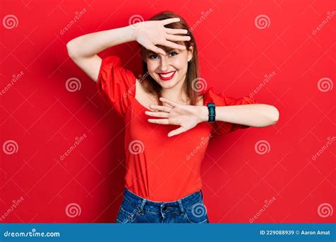 Redhead Young Woman Wearing Casual Red T Shirt Smiling Cheerful Playing