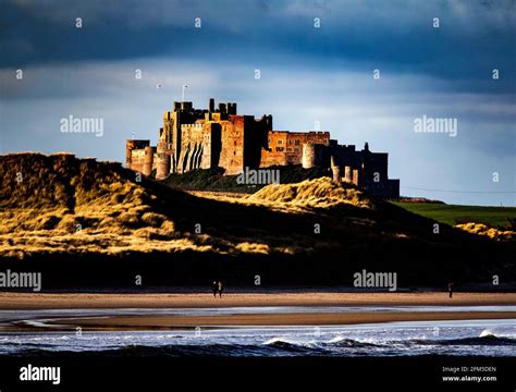 Bamburgh Castle From The Harbor At Seahouses Stock Photo Alamy