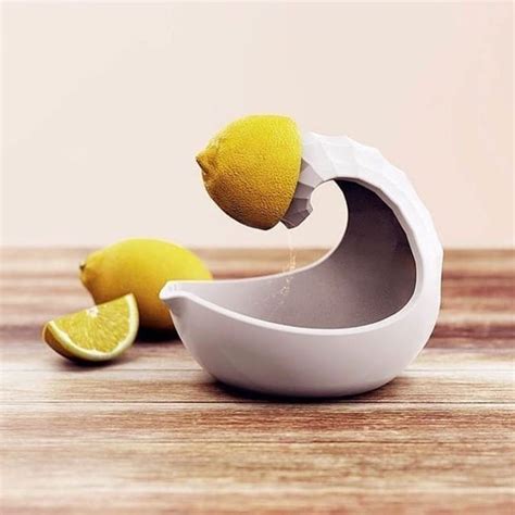 A Lemon Being Squeezed Into A White Bowl