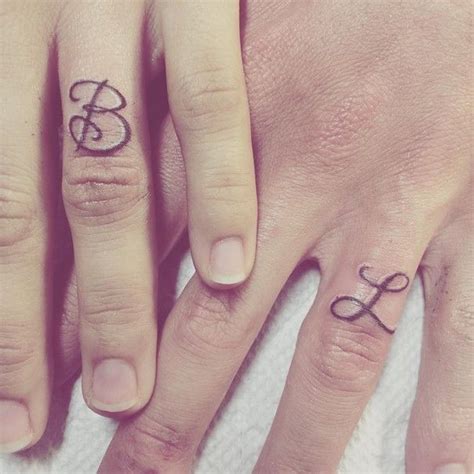 Initial Tattoos On Ring Finger