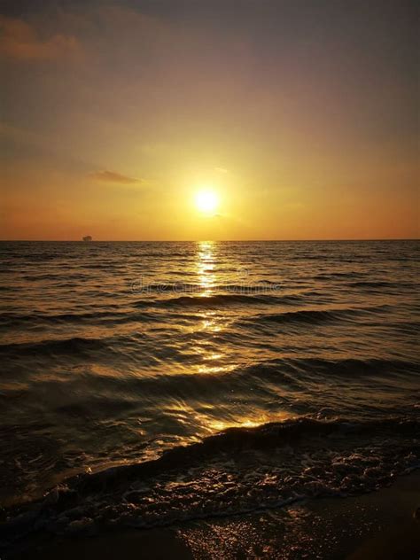 Vertical Shot Of The Majestic Sunset Over The Ocean In The Evening