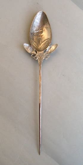 a Bolivian silver 'topo' (or 'tupo') pin spoon from a small collection ...