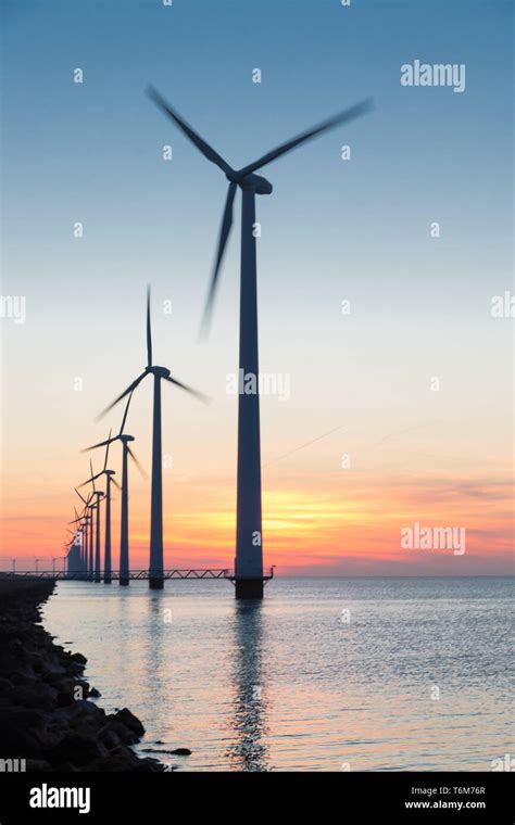 Dutch Row Offshore Wind Turbines At Beautiful Sunset Stock Photo Alamy