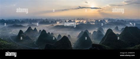 South of guilin karst landform morning mist sunrise scene Stock Photo ...