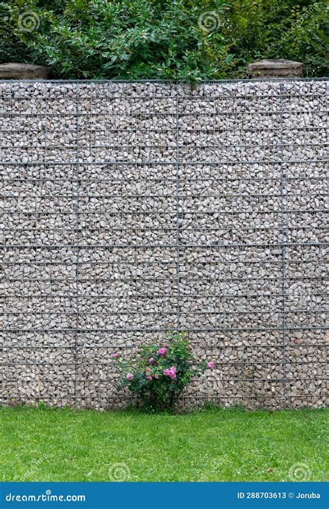 Gabion Wall Made Of Natural Stone And Metal Mesh Royalty Free Stock