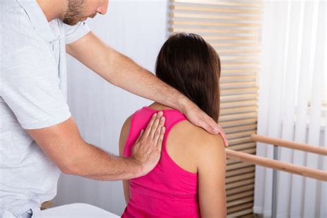 Therapist Massaging Womans Back Integrative Pain Science Institute