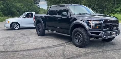 F 150 Raptor Takes On Second Gen Lightning In Blue Oval Battle Video