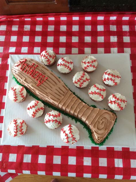 Baseball Bat Cake And Baseball Cupcakes Baseball Birthday Party Bat Cake Themed Cupcakes