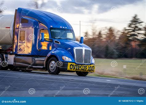 Big Rig Blue Bonnet Semi Truck With Sign Oversize Load On The Front