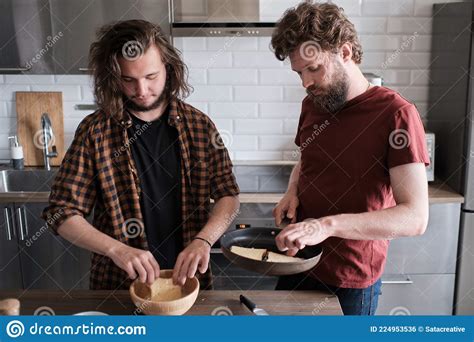 Two Men Cooking Sandwiches In The Kitchen Stock Photo Image Of Couple