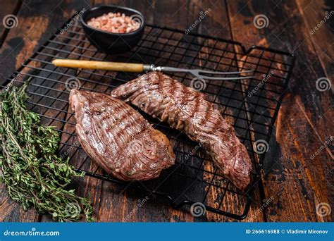 Grilled Sirloin Flap Or Bavette Beef Meat Steak On A Griil With Herbs Wooden Background Stock