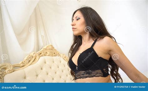 Slim Woman Wearing Black Stockings And Lace Lingerie Sitting On Bed At Hotel Room Stock Footage