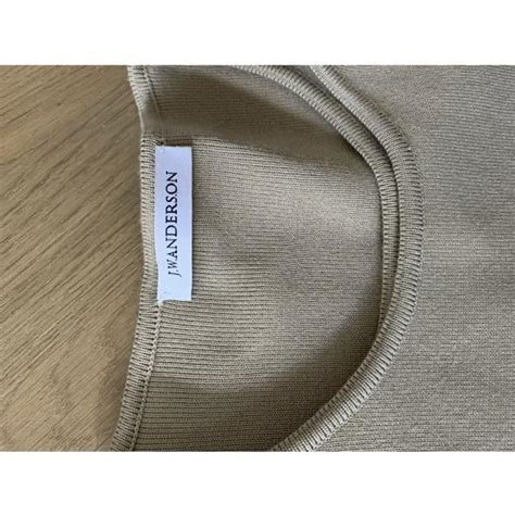 Jw Anderson Women S White And Tan Jumper Depop