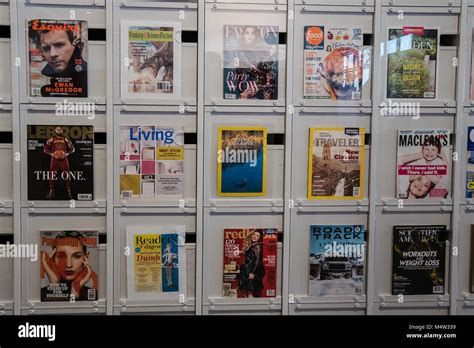 magazine display on wall Stock Photo - Alamy