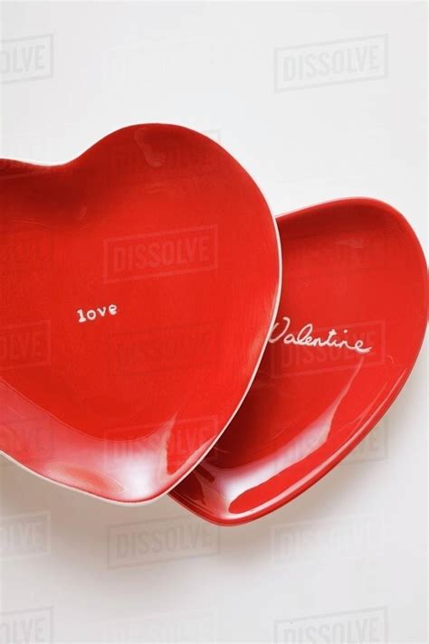 Red Heart Shaped Plates With The Words Be My Valentine And Love Stock