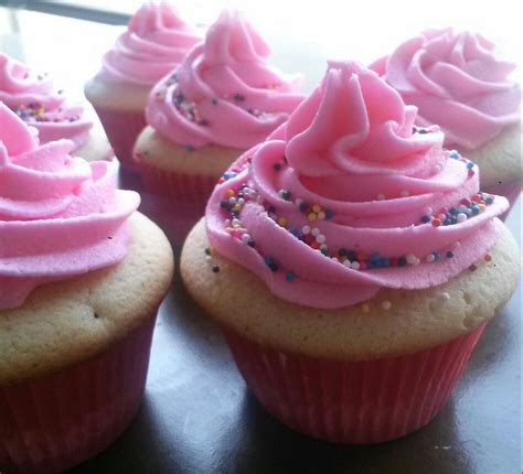 Cupcakes With Pink Frosting And Sprinkles On Top