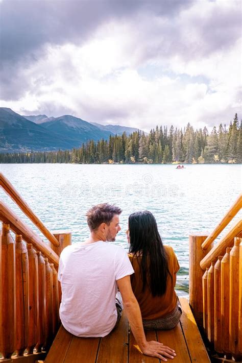 Jasper Town Canada Couple At Lakeshore Sunrise By The Lake At Jasper Lac Beauvert Alberta