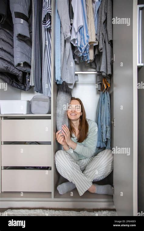 Woman Hiding Wardrobe Hi Res Stock Photography And Images Alamy