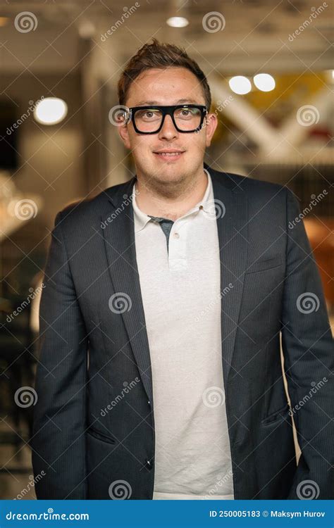 Smiling Young Businessman In Glasses Look In Camera Distance Thinking