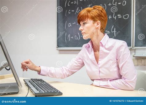 Young Woman Teacher In College Instruction In A University Classroom