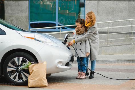 A Stylish Mother Teaches Her Daughter How To Properly Charge An