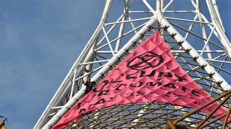 Extinction Rebellion Protester Climbs Melbourne Arts Centre