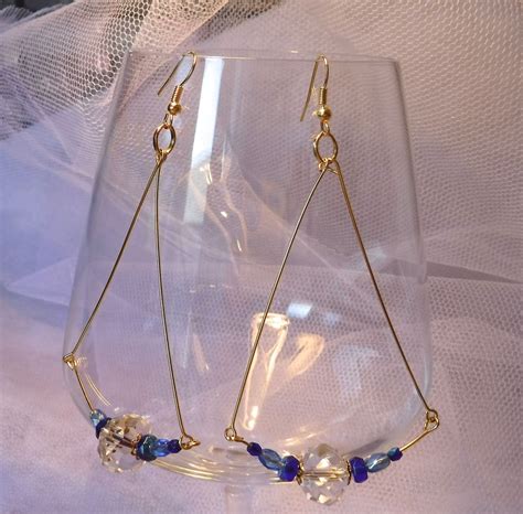 Boucles D Oreilles Longues Perles Facettes Transparentes Et Bleues