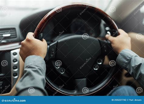 Hands On The Wheel Hands Holding Onto A Steering Wheel While Driving