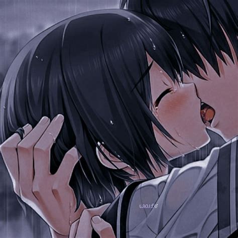 Two People Kissing In The Rain With One Holding His Head To His Other S Ear