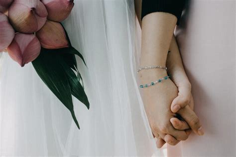 Premium Photo Midsection Of Lesbian Couple Holding Hands