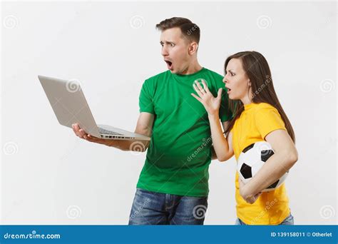 Shocked Couple Woman Man Football Fans In Yellow Green T Shirt Cheer