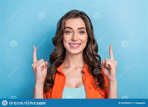 Photo Of Cheerful Shiny Woman Dressed Orange Jacket Pointing Two