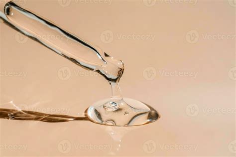 A Drop Of Cosmetic Oil Falls From The Pipette Stock Photo At