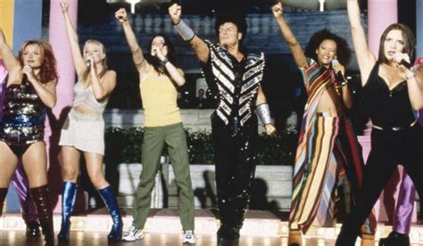 British Glam Rock Star Gary Glitter Poses Alongside The Spice Girls In