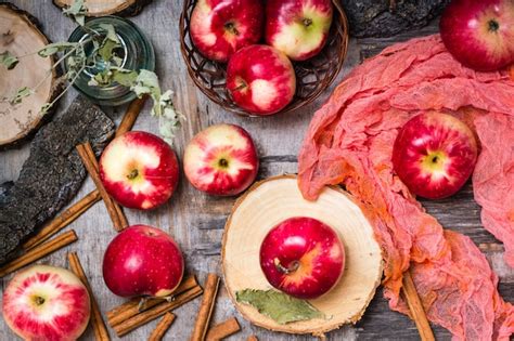 Premium Photo Ripe Apples On A Wooden Table Top View