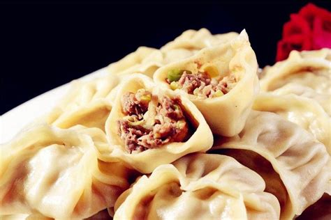 Some Dumplings Are Sitting On A White Plate