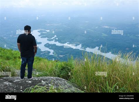 Indian man trekking on mountain top at Munnar Idukki Thekkady Kerala ...