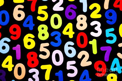 Brightly coloured numbers on black background Photograph by Jacques ...