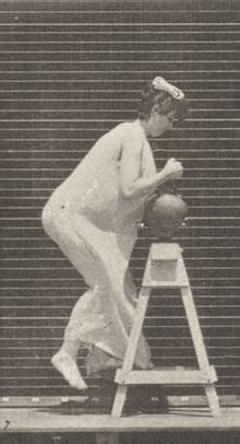 File Semi Nude Woman Bending To Fill A Water Jar Placing It On Head