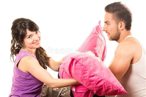 Cute Attractive Couple Having A Pillow Fight Stock Photo Image Of Beautiful Brunette 49940338