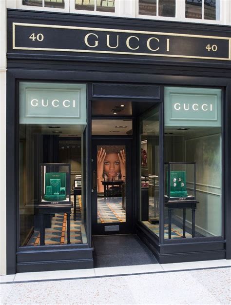 Gucci Storefront With Hands Up