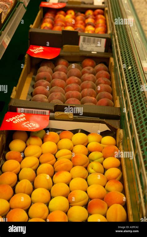 Peaches Plums And Apples On Display On Supermarket Shelf Stock Photo