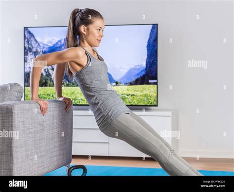 Home Fitness Woman Strength Training Arms Watching Online Tv Dvd