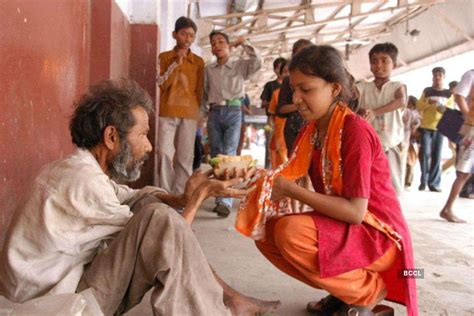 A Poor Girl Helps A Beggar By Serving Him Food Photogallery