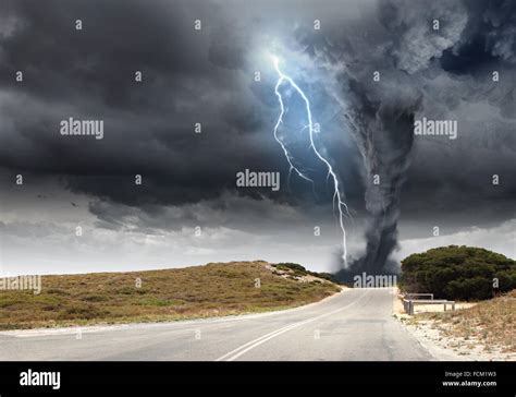 Powerful Tornado And Lightning Above Countryside Road Stock Photo Alamy