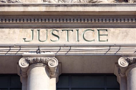 Justice Sign On A Courthouse Building Avanti Law Group